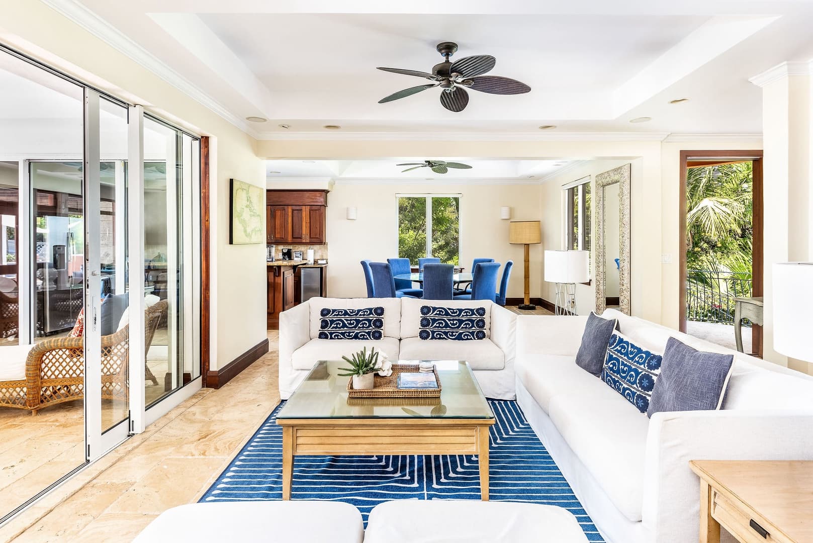 Villa La Percha living and dining room opening to screened outdoor space